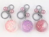 Breloczki dla dzieci - ADAR Brelok kułko z woda i brokatem p12 mix 512481 cena za 1 szt - miniaturka - grafika 1