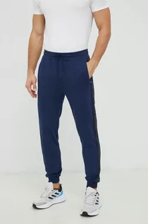 Spodnie męskie - Guess spodnie dresowe męskie kolor granatowy z nadrukiem - grafika 1