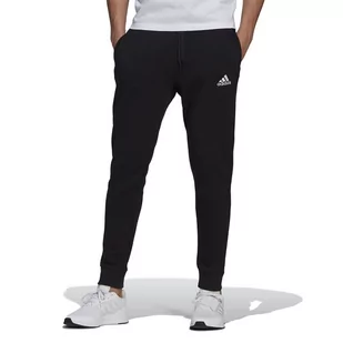 Spodnie dresowe adidas Essentials Fleece Regular Fit Tapered Cuff GK9268 - czarne - Adidas - Spodnie sportowe męskie - miniaturka - grafika 1