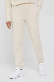 Spodnie damskie - Calvin Klein spodnie dresowe damskie kolor beżowy gładkie - grafika 1
