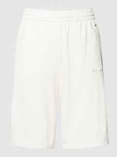 Spodnie sportowe męskie - Szorty z dzianiny dresowej z wyhaftowanymi logo - grafika 1