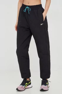 Spodnie damskie - Reebok spodnie sportowe Thermowarm + Graphene damskie kolor czarny gładkie - grafika 1