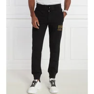 Dresy męskie - Versace Jeans Couture Spodnie dresowe | Oversize fit - miniaturka - grafika 1