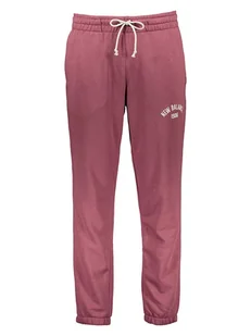 New Balance Spodnie dresowe "Essentials Varsity" w kolorze różowym - Spodnie sportowe męskie - miniaturka - grafika 1