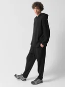 Spodnie męskie - Męskie spodnie dzianinowe Outhorn OTHWSS24TTROM1050 - czarne - miniaturka - grafika 1