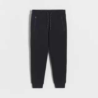 Spodnie i spodenki dla chłopców - Reserved - Dresowe spodnie jogger - Czarny - grafika 1