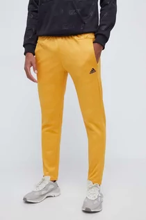 Spodnie męskie - adidas spodnie dresowe kolor żółty wzorzyste - grafika 1