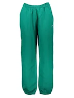 Spodnie sportowe damskie - Nike Spodnie dresowe "NRG" w kolorze zielonym - miniaturka - grafika 1