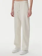 Spodnie sportowe damskie - Puma Spodnie dresowe Ess 629774 Beżowy Straight Fit - miniaturka - grafika 1