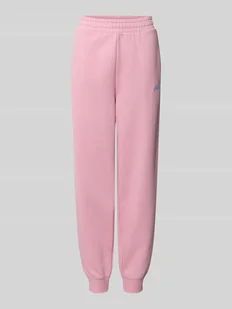 Spodnie dresowe o kroju slim fit z wyhaftowanym logo - Spodnie sportowe damskie - miniaturka - grafika 1