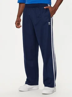 adidas Spodnie dresowe adicolor Firebird IZ2466 Granatowy Baggy Fit - Spodnie sportowe męskie - miniaturka - grafika 1