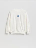 Bluzy dla chłopców - Reserved - Bawełniana bluza oversize - złamana biel - miniaturka - grafika 1