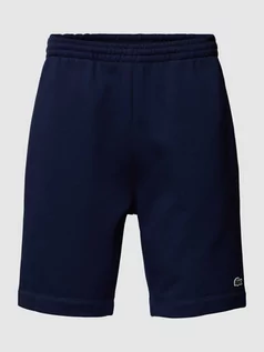 Spodnie sportowe męskie - Szorty o kroju regular fit z elastycznym pasem - grafika 1
