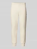 Spodnie sportowe męskie - Spodnie dresowe o kroju slim fit z naszywką z logo - miniaturka - grafika 1