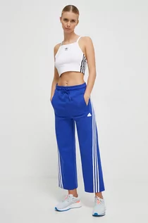 Spodnie damskie - adidas spodnie dresowe kolor niebieski z aplikacją - grafika 1