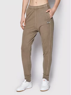 Spodnie sportowe damskie - Reebok Spodnie dresowe Classics Natural Dye HN4393 Brązowy Slim Fit - grafika 1