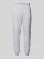 Spodnie sportowe męskie - Spodnie dresowe o kroju slim fit z naszywką z logo - miniaturka - grafika 1