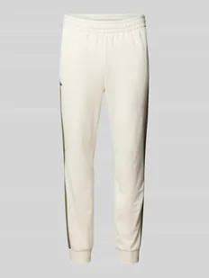 Spodnie dresowe o kroju slim fit z elastycznym pasem - Spodnie sportowe męskie - miniaturka - grafika 1