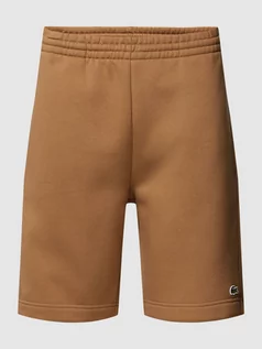 Spodnie sportowe męskie - Szorty z dzianiny dresowej z aplikacją z logo - grafika 1