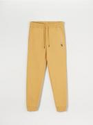 Spodnie męskie - Sinsay - Spodnie dresowe jogger - żółty - miniaturka - grafika 1
