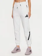 Spodnie sportowe damskie - adidas Spodnie dresowe Z.N.E. JE7843 Biały Regular Fit - miniaturka - grafika 1