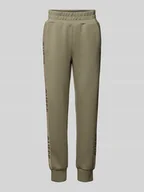 Spodnie sportowe damskie - Spodnie dresowe o kroju slim fit z nadrukami z logo - miniaturka - grafika 1