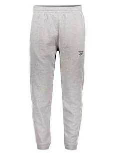 Reebok Spodnie "Wor Piping" w kolorze szarym - Spodnie sportowe męskie - miniaturka - grafika 1