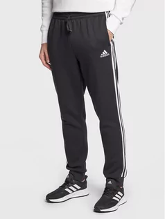 Spodnie sportowe męskie - adidas Spodnie dresowe Essentials Fleece GK8821 Czarny Regular Fit - grafika 1