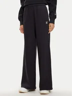 Spodnie sportowe damskie - Champion Spodnie dresowe 117661 Czarny Wide Leg - miniaturka - grafika 1