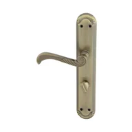 Klamki - Domino Klamka do drzwi wewnętrznych z długim szyldem do wc Casablanka 72 Lewa mosiądz/patyna - miniaturka - grafika 1