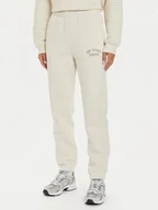 Spodnie sportowe damskie - New Balance Spodnie dresowe WP43500 Beżowy Relaxed Fit - miniaturka - grafika 1