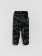 Spodnie i spodenki dla chłopców - Reserved - Bawełniane spodnie jogger - czarny - miniaturka - grafika 1