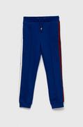 Spodnie i spodenki dla chłopców - Tommy Hilfiger spodnie dresowe dziecięce kolor granatowy z aplikacją - miniaturka - grafika 1