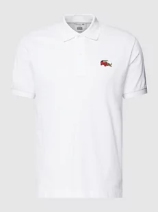 Koszulka polo z naszywką z logo LACOSTE x Netflix - Koszulki męskie - miniaturka - grafika 1