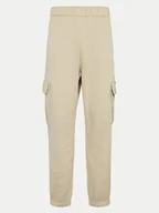 Spodnie sportowe damskie - Champion Spodnie dresowe 117554 Beżowy Loose Fit - miniaturka - grafika 1