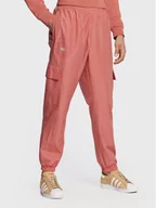 Spodnie sportowe męskie - adidas Spodnie dresowe Ozworld HL9254 Pomarańczowy Regular Fit - miniaturka - grafika 1