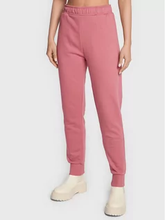 Spodnie sportowe damskie - Outhorn Spodnie dresowe TTROF041 Różowy Relaxed Fit - grafika 1