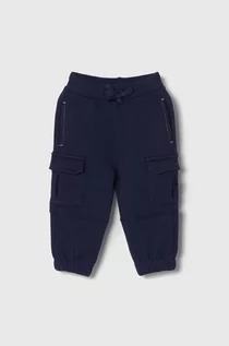 Spodnie i spodenki dla chłopców - United Colors of Benetton spodnie dresowe bawełniane dziecięce kolor granatowy gładkie - grafika 1