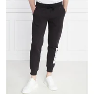 Dresy męskie - CALVIN KLEIN JEANS Spodnie dresowe | Regular Fit - miniaturka - grafika 1