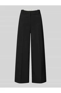 Chinosy o kroju tapered fit z wpuszczanymi kieszeniami - Tommy Hilfiger - Spodnie sportowe damskie - miniaturka - grafika 1