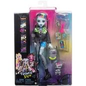 Plecaki - Monster High Lagoona Blue Lalka w siateczkowej koszulce i bojówkach z figurką rybki Neptuny i akcesoriami, takimi jak plecak, „przekąska” i notatnik, HXH75 - miniaturka - grafika 1
