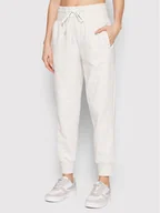 Spodnie sportowe damskie - New Balance Spodnie dresowe WP21511 Beżowy Relaxed Fit - miniaturka - grafika 1
