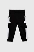 Spodnie i spodenki dla chłopców - Guess spodnie dresowe bawełniane dziecięce kolor czarny wzorzyste - miniaturka - grafika 1