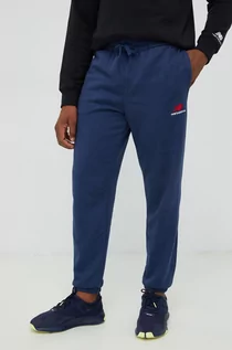 Spodnie męskie - New Balance spodnie dresowe męskie kolor granatowy z aplikacją - grafika 1