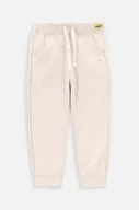 Spodnie i spodenki dla dziewczynek - Coccodrillo spodnie dresowe niemowlęce kolor beżowy gładkie - miniaturka - grafika 1