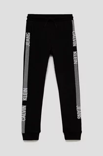 Spodnie damskie - Calvin Klein Jeans Jeans Spodnie bawełniane dziecięce kolor czarny z nadrukiem - grafika 1