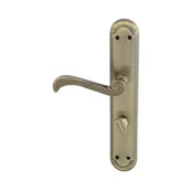 Klamki - Domino Klamka do drzwi wewnętrznych z długim szyldem do wc Casablanka 72 Lewa mosiądz/patyna - miniaturka - grafika 1