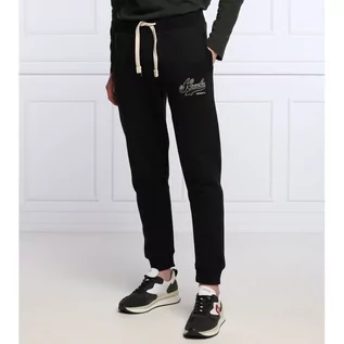 Spodnie męskie - Superdry Spodnie dresowe Vintage Collegiate | Regular Fit - grafika 1