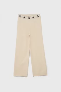 Spodnie damskie - Calvin Klein Jeans Jeans Spodnie dziecięce kolor beżowy gładkie - grafika 1