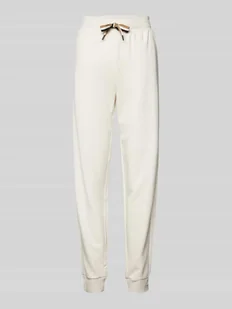 Spodnie dresowe o kroju relaxed fit z tunelem model ‘STRIPE’ - Spodnie sportowe damskie - miniaturka - grafika 1